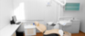 out-of-focus dental chair and exam room